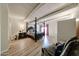 Spacious main bedroom features exposed beam ceiling, hardwood floors, and 4-poster bed at 1425 E Desert Cove Ave # 35, Phoenix, AZ 85020