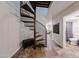 Unique spiral staircase feature with a peek into the living area and bathroom at 1425 E Desert Cove Ave # 35, Phoenix, AZ 85020