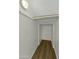 An attic storage area with a drop-down ladder and a wooden-style floor at 14754 W Amelia Ave, Goodyear, AZ 85395