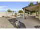 Enjoy the beautiful pool, covered patio, and low-maintenance landscaping in this outdoor oasis at 14754 W Amelia Ave, Goodyear, AZ 85395