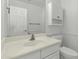 Bathroom with sink, toilet, and a mirror at 14754 W Amelia Ave, Goodyear, AZ 85395