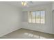 Neutral bedroom with ceiling fan, a recessed alcove and a shuttered window providing ample natural light at 14754 W Amelia Ave, Goodyear, AZ 85395
