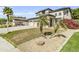 Well-maintained home boasts desert landscaping, vibrant bougainvillea, and a spacious three-car garage at 14754 W Amelia Ave, Goodyear, AZ 85395