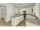 The kitchen features a center island, stainless steel appliances, and ample counter space at 14754 W Amelia Ave, Goodyear, AZ 85395