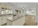 Kitchen with island, stainless steel appliances, and connecting living room at 14754 W Amelia Ave, Goodyear, AZ 85395
