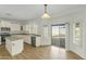Eat-in kitchen with a view of the pool and a sliding glass door at 14754 W Amelia Ave, Goodyear, AZ 85395