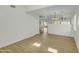 The living room features vinyl floors, bright light, and an open floorplan at 14754 W Amelia Ave, Goodyear, AZ 85395