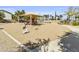 Community playground with slides, seesaws and shade at 14754 W Amelia Ave, Goodyear, AZ 85395