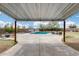 This spacious backyard features a covered patio with a pool, hot tub, and outdoor seating for relaxing and entertaining at 1517 E Elaine Dr, Casa Grande, AZ 85122