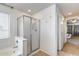 Bathroom featuring a soaking tub with a glass-enclosed shower and adjacent views of the main bedroom at 1517 E Elaine Dr, Casa Grande, AZ 85122