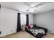 This bedroom has a ceiling fan, window, carpet and is tastefully decorated at 1517 E Elaine Dr, Casa Grande, AZ 85122