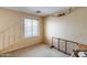 Bright, carpeted bedroom features natural light and a window with blinds for privacy at 1517 E Elaine Dr, Casa Grande, AZ 85122