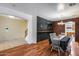 The dining room has brick walls, wood floors, and a dark painted chalkboard wall at 1517 E Elaine Dr, Casa Grande, AZ 85122