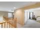 Upstairs hallway shows natural light, neutral walls, and open access to a carpeted bedroom at 1517 E Elaine Dr, Casa Grande, AZ 85122