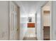 Hallway view features a tile floor, closet and the door to the bathroom, complete with a dual sink vanity at 1517 E Elaine Dr, Casa Grande, AZ 85122