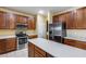 Spacious kitchen features stainless steel appliances, an island, and plenty of cabinet space at 1517 E Elaine Dr, Casa Grande, AZ 85122