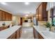 Open kitchen design with island, stainless appliances, ample cabinet space, and open view to living area at 1517 E Elaine Dr, Casa Grande, AZ 85122