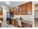 This well-designed kitchen features a desk area, stainless appliances, and abundant cabinet space at 1517 E Elaine Dr, Casa Grande, AZ 85122