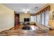Comfortable living room with laminate floors, ceiling fan, and sliding barn door for added style at 1517 E Elaine Dr, Casa Grande, AZ 85122