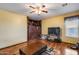 This living room features laminate floors, ceiling fan, and a barn door for a unique look at 1517 E Elaine Dr, Casa Grande, AZ 85122
