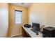 An office or study features a built-in desk, window, and carpet at 1517 E Elaine Dr, Casa Grande, AZ 85122