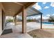 A covered patio overlooks a pool, hot tub, and a large yard at 1517 E Elaine Dr, Casa Grande, AZ 85122