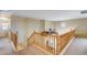 Upper landing and staircase with carpeted steps and light wood railing at 1517 E Elaine Dr, Casa Grande, AZ 85122