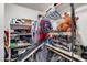 Fully stocked walk-in closet offering ample storage capacity with a variety of shelving, hanging, and floor space at 1517 E Elaine Dr, Casa Grande, AZ 85122