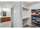 Spacious walk-in closet featuring plenty of shelving and storage options with carpeted floors at 1517 E Elaine Dr, Casa Grande, AZ 85122