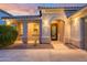 Charming home with a covered front porch, beautiful landscaping, and a welcoming entrance, perfect for Gathering and guests at 15796 W Shaw Butte Dr, Surprise, AZ 85379