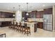 Spacious kitchen with granite countertops, stainless steel appliances, large island and ample storage for cooking and entertaining at 15796 W Shaw Butte Dr, Surprise, AZ 85379