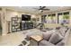 Comfortable living room features plush sectional seating and ample natural light at 15796 W Shaw Butte Dr, Surprise, AZ 85379