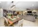 Spacious open-concept living space, seamlessly connecting the kitchen, dining, and living areas at 15796 W Shaw Butte Dr, Surprise, AZ 85379