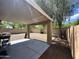 Large backyard with a covered patio and gravel landscaping, perfect for entertaining at 16010 N 170Th Ln, Surprise, AZ 85388