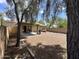 Large backyard with mature trees, covered patio, gravel groundcover and block fence at 16010 N 170Th Ln, Surprise, AZ 85388