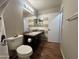 This bathroom features a shower-tub combo and modern vanity with dark cabinets at 16010 N 170Th Ln, Surprise, AZ 85388
