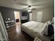 Spacious bedroom with wood look floors, en-suite bathroom, and large closet at 16010 N 170Th Ln, Surprise, AZ 85388