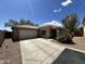 Beautiful single-story home featuring desert landscaping, a tile roof, and a two-car garage at 16010 N 170Th Ln, Surprise, AZ 85388