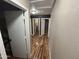 The hallway features laminate wood floors connecting the living area to the bedrooms at 16010 N 170Th Ln, Surprise, AZ 85388