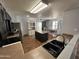 Open kitchen with an island and view to the dining area and backyard at 16010 N 170Th Ln, Surprise, AZ 85388