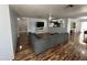 Spacious living room with hardwood floors and gray sofa at 16010 N 170Th Ln, Surprise, AZ 85388