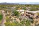 Aerial view of estate featuring a patio, desert landscaping, and mountain views at 1607 N Quartz Valley Rd, Scottsdale, AZ 85266