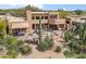 Desert home featuring an outdoor patio with lush landscaping at 1607 N Quartz Valley Rd, Scottsdale, AZ 85266