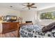 Well-lit bedroom featuring a cozy bed and dresser with desert landscape views at 1607 N Quartz Valley Rd, Scottsdale, AZ 85266