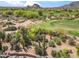 Scenic golf course view highlighting the desert landscape with cacti and mountain views at 1607 N Quartz Valley Rd, Scottsdale, AZ 85266