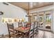 Spacious dining room with wooden table and chairs, decorative lighting, and desert view at 1607 N Quartz Valley Rd, Scottsdale, AZ 85266