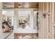Desert home with tiled foyer, leading to living area with fireplace and grand piano at 1607 N Quartz Valley Rd, Scottsdale, AZ 85266