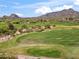 Scenic view of the lush green golf course with mountains in the distance at 1607 N Quartz Valley Rd, Scottsdale, AZ 85266