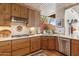 Warm kitchen featuring wood cabinets, stainless steel appliances and a garden view at 1607 N Quartz Valley Rd, Scottsdale, AZ 85266