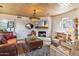 Relaxing living room area featuring a fireplace, comfortable seating, and artistic decor at 1607 N Quartz Valley Rd, Scottsdale, AZ 85266